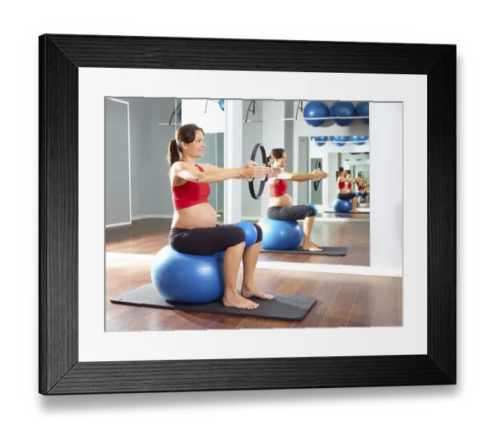 Framed Print : Pregnant woman pilates exercise magic ring with fitball