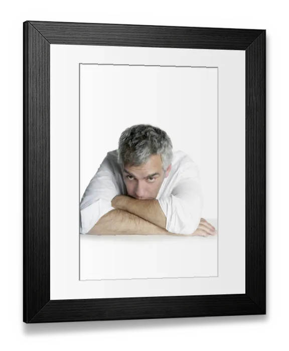 Framed Print : Bored senior businessman on table desk hands crossed white background
