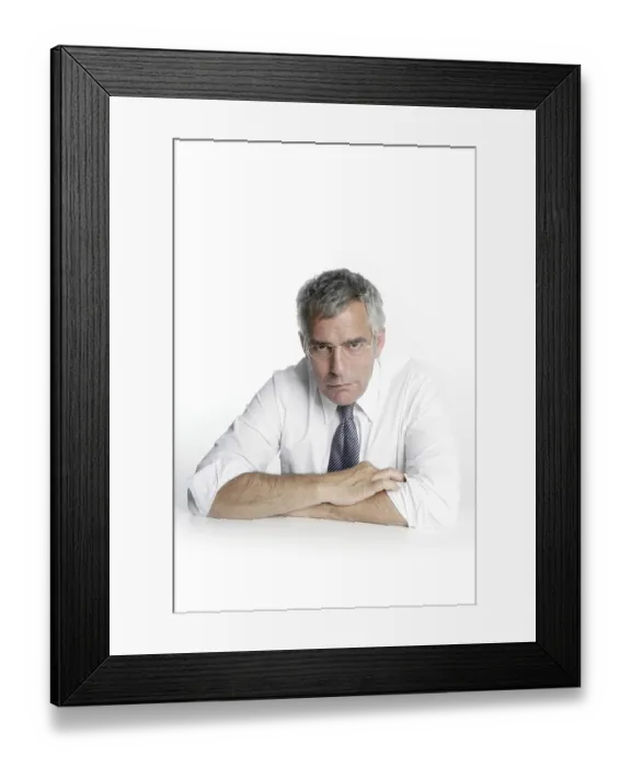Framed Print : Businessman senior glasses relaxed portrait white desk background