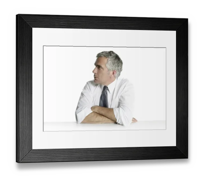 Framed Print : Businessman senior profile relaxed sit portrait white desk background Framed Print : Businessman senior profile relaxed sit portrait white desk background