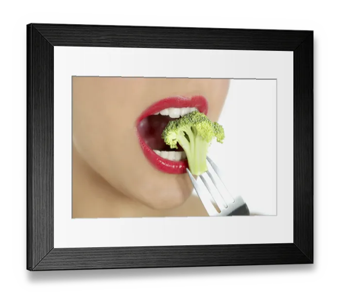 Framed Print : Broccoli on steel fork in woman mouth with red lips