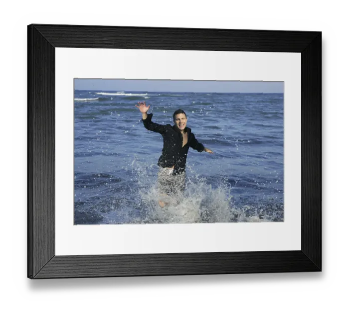 Framed Print : Man running happy on the blue summer beach