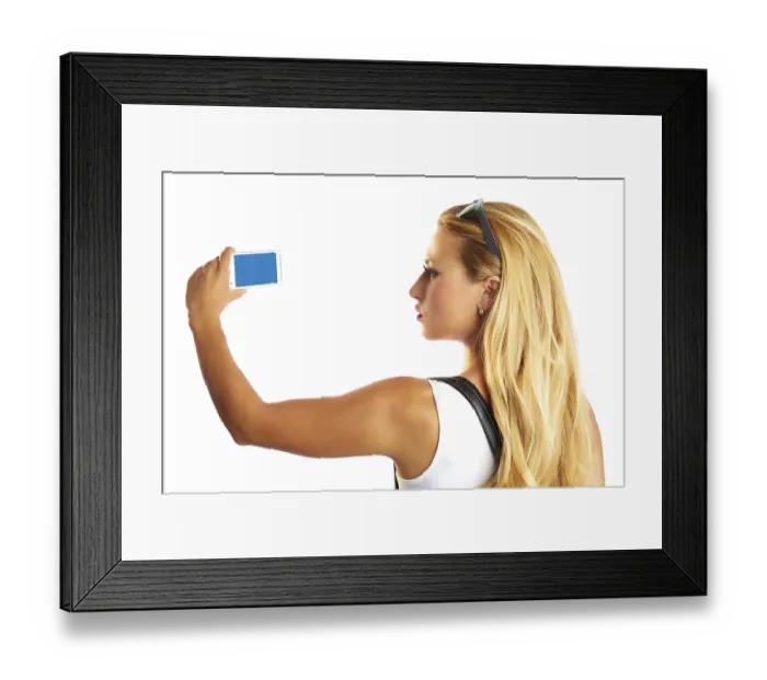 Framed Print : Blond tourist girl taking photos with smartphone on white background