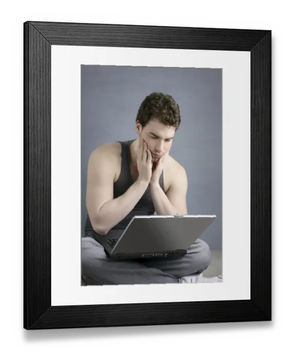 Framed Print : Student gesture with laptop over gray background Framed Print : Student gesture with laptop over gray background