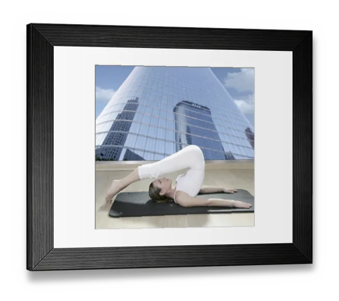 Framed Print : Black mat yoga woman window view of city urban buildings