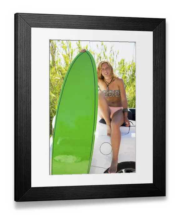 Framed Print : Blond teen surfer happy girl with green surfboard on California convertible car