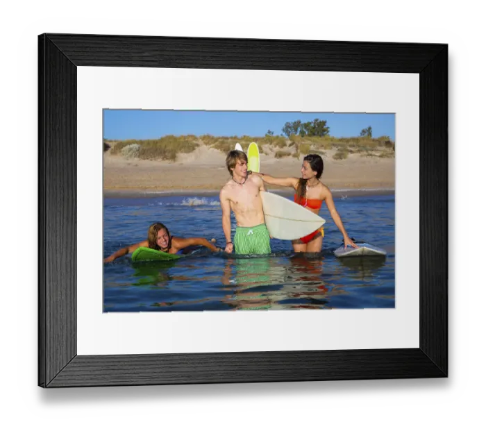Framed Print : Happy beautiful teen surfers talking on beach shore smiling