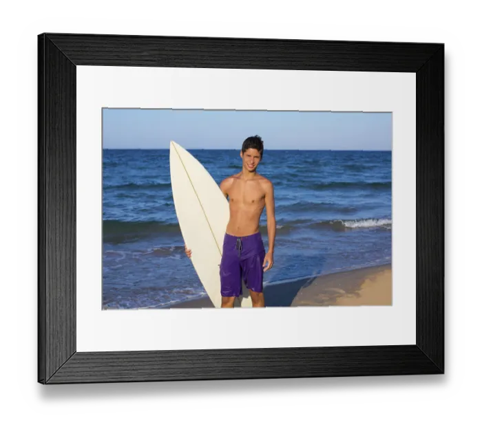 Framed Print : Boy teen surfer happy holing surfboard on the beach shore Framed Print : Boy teen surfer happy holing surfboard on the beach shore