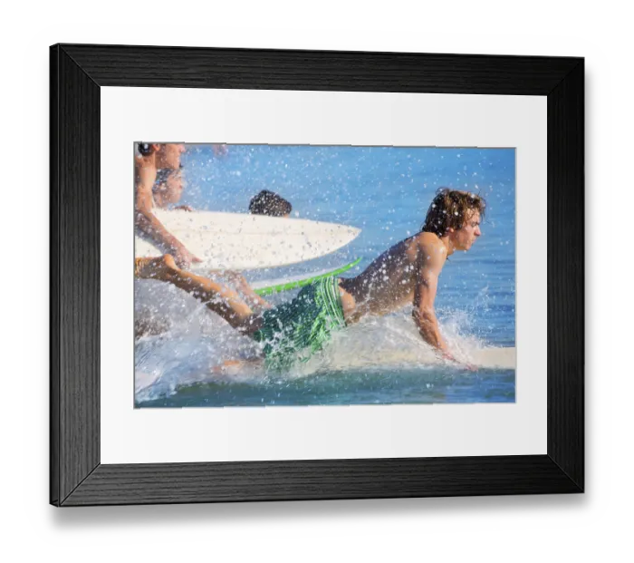Framed Print : Boys teen surfers surfing running jumping on surfboards at the beach Framed Print : Boys teen surfers surfing running jumping on surfboards at the beach
