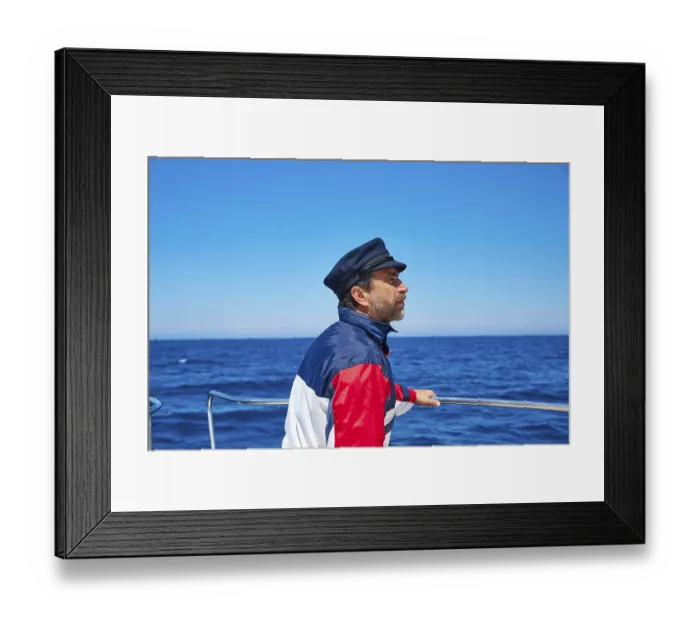 Framed Print : Beard sailor man sailing sea ocean in a boat with captain cap looking horizon