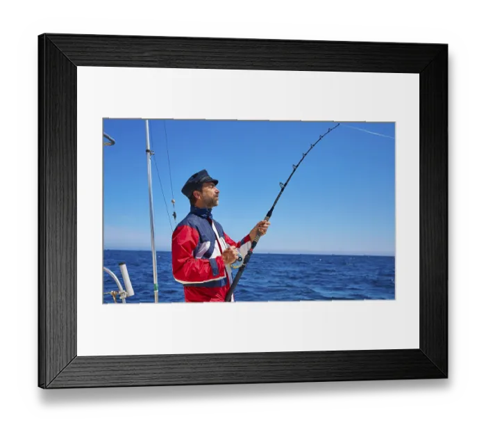 Framed Print : Beard sailor man fishing rod trolling in saltwater in a boat trolling with captain cap