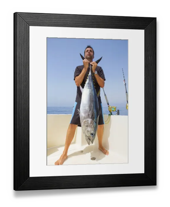 Framed Print : Big Bluefin tuna catch by fisherman on boat trolling posing on deck Framed Print : Big Bluefin tuna catch by fisherman on boat trolling posing on deck