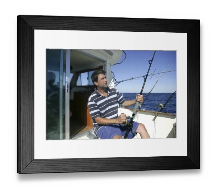 Framed Print : Angler big game saltwater fisher boat with rods and reels