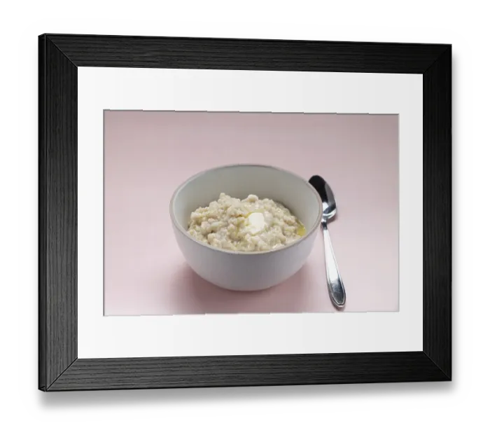 Framed Print : Oatmeal with butter in a white plate