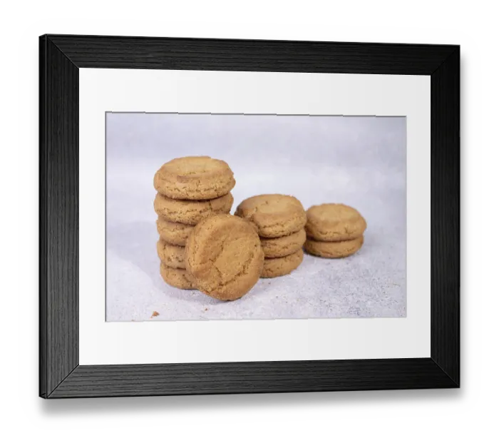Framed Print : Stacks of homemade oatmeal cookies on a white background