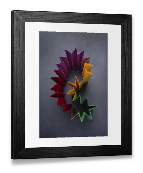 Framed Print : Construction of colored paper on a dark background