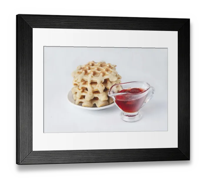 Framed Print : Homemade waffles with strawberry jam on a white background