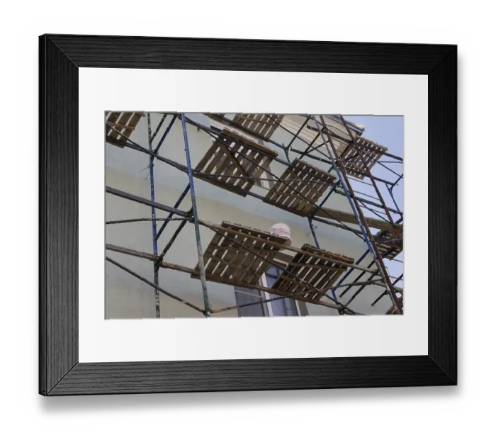 Framed Print : Facade of a residential building in scaffolding Framed Print : Facade of a residential building in scaffolding