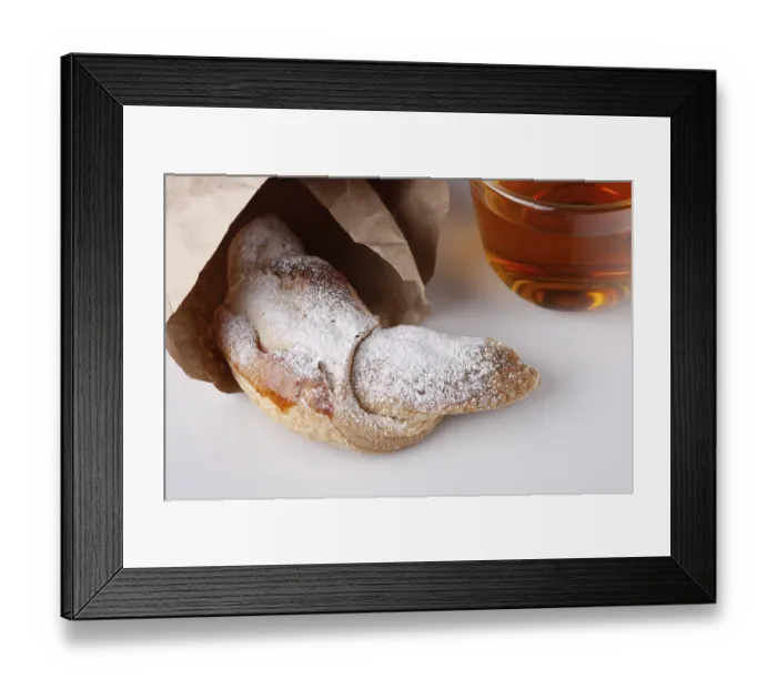 Framed Print : Croissant and a cup of tea on a white background Framed Print : Croissant and a cup of tea on a white background