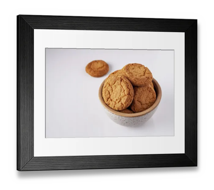 Framed Print : Round oatmeal cookies lie in a gray ceramic bowl