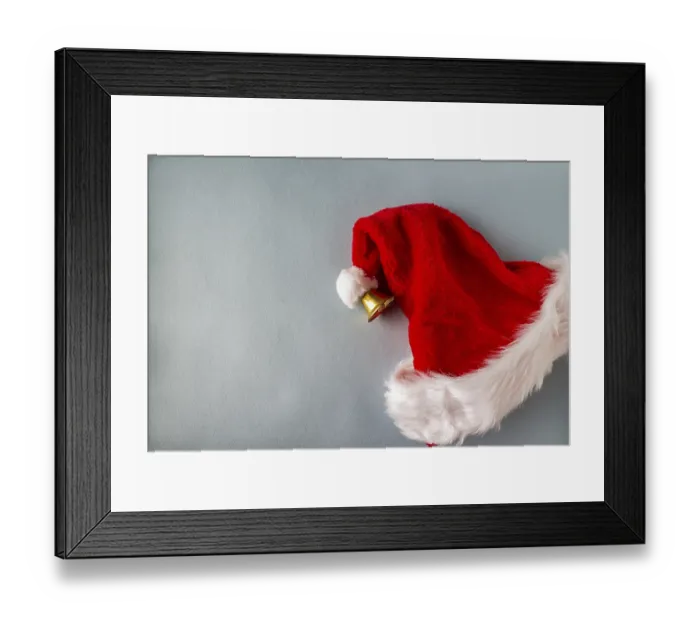 Framed Print : Santa claus hat with bell on blue background Framed Print : Santa claus hat with bell on blue background