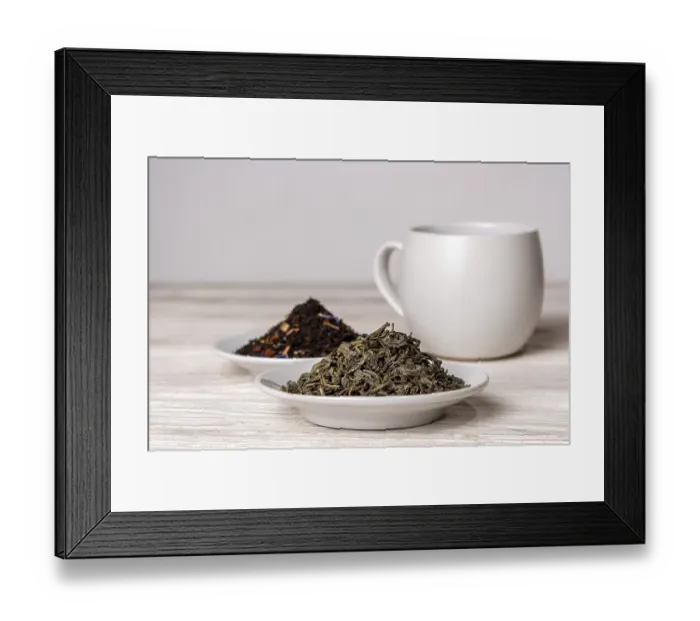 Framed Print : Varieties of black and green tea in saucers on a white background