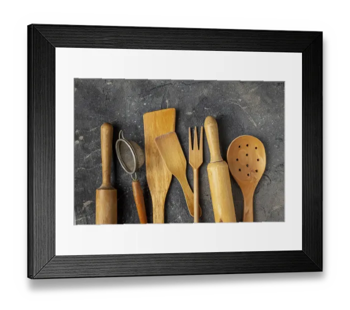Framed Print : Set of wooden kitchen utensils on a blue background