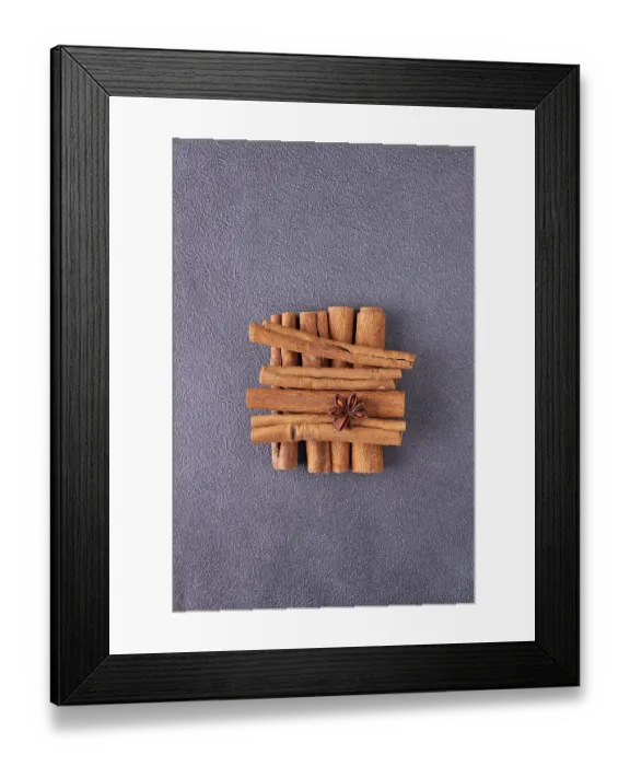Framed Print : Cinnamon sticks, star anise on blue background