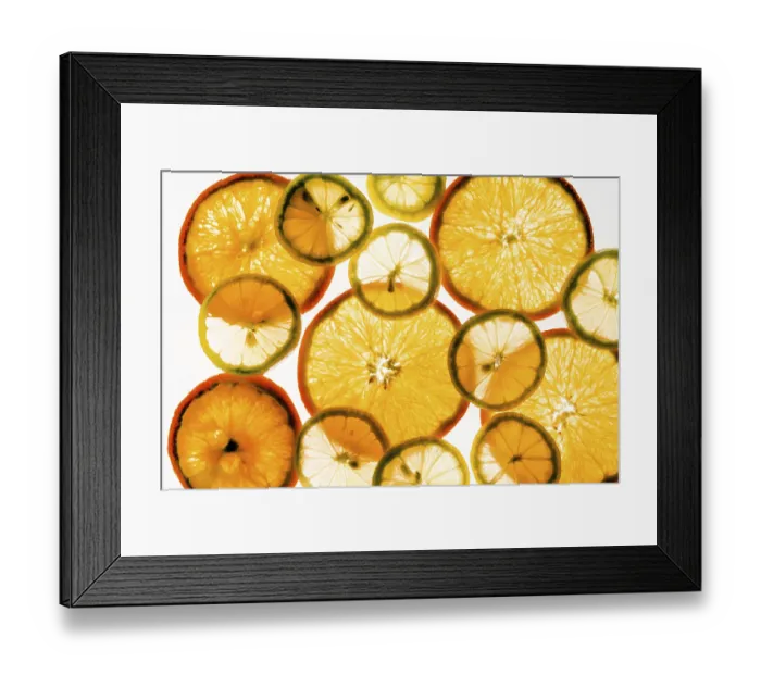 Framed Print : Transparent slices of lemon and orange in the light