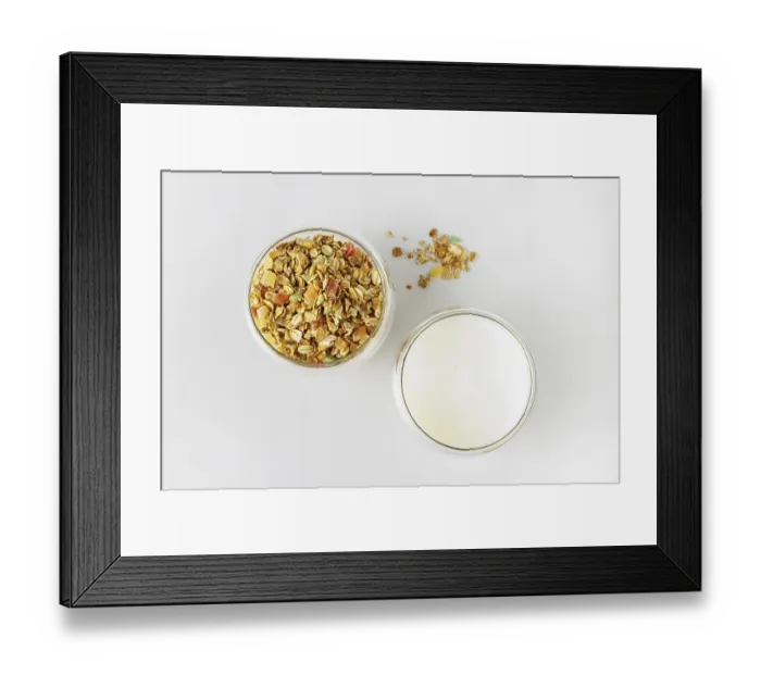 Framed Print : Glass with dry cereal and glass with yogurt on white background