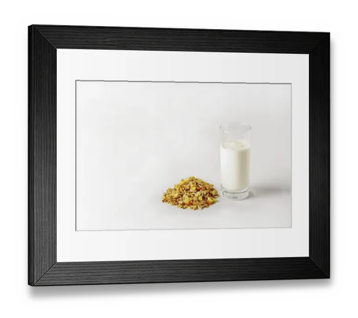 Framed Print : A glass of yogurt and a bunch of muesli on a white background Framed Print : A glass of yogurt and a bunch of muesli on a white background