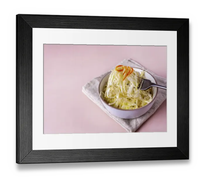 Framed Print : Fermented cabbage on a fork on a beige background Framed Print : Fermented cabbage on a fork on a beige background