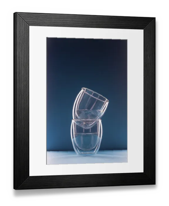 Framed Print : Two glasses with water on a blue background with copy space