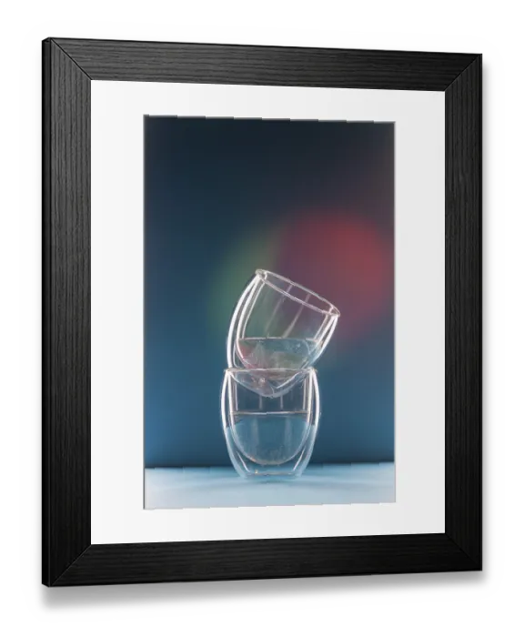 Framed Print : Two glasses with water on a colorful background with copy space Framed Print : Two glasses with water on a colorful background with copy space