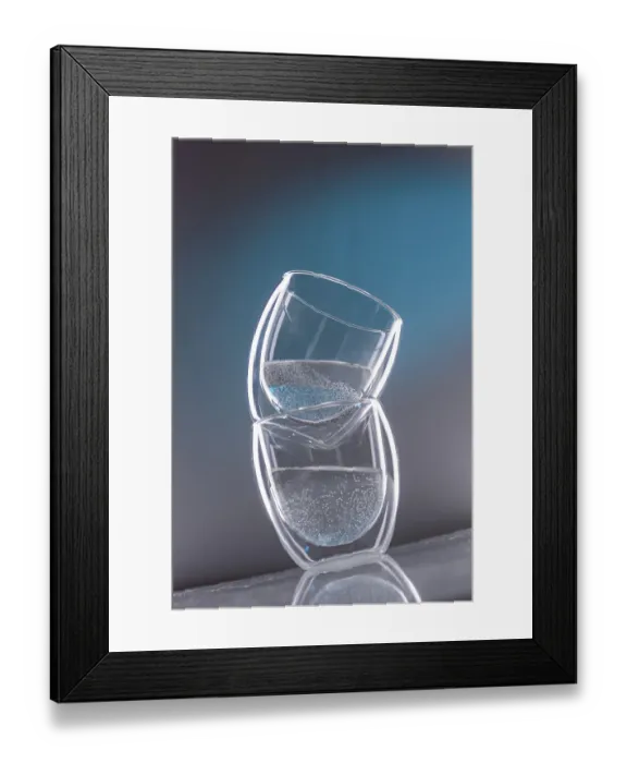 Framed Print : Two glasses with water on a slanted blue background Framed Print : Two glasses with water on a slanted blue background
