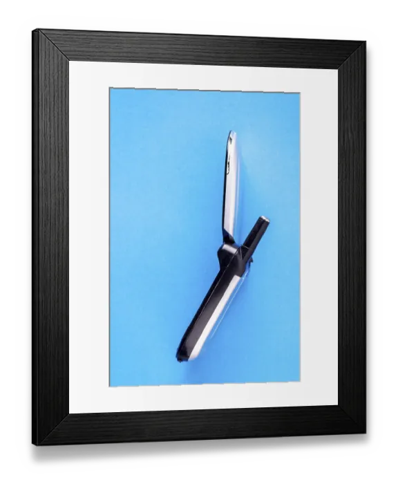 Framed Print : Vintage push-button mobile phone without camera on blue background with copy space Framed Print : Vintage push-button mobile phone without camera on blue background with copy space
