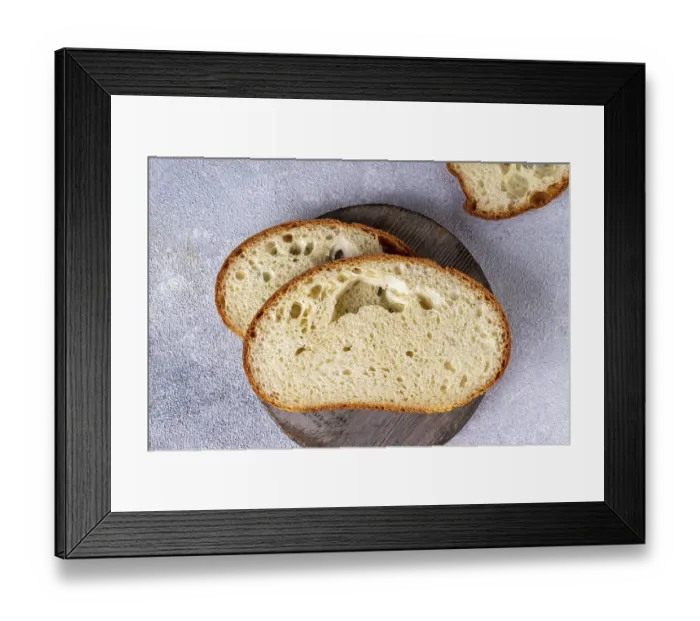 Framed Print : White texture bread on a round wooden board Framed Print : White texture bread on a round wooden board