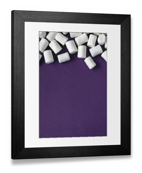 Framed Print : White marshmallow scattered over purple background Framed Print : White marshmallow scattered over purple background