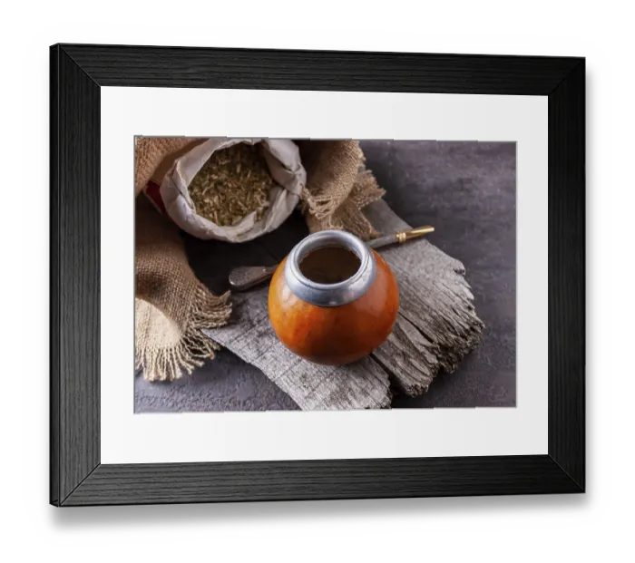 Framed Print : Bombilla with colabash and bag of mate tea on wooden background