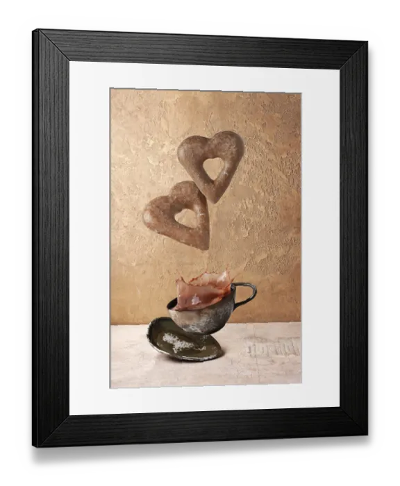 Framed Print : Heart shaped gingerbread cookies flying over coffee cup with splashes Framed Print : Heart shaped gingerbread cookies flying over coffee cup with splashes