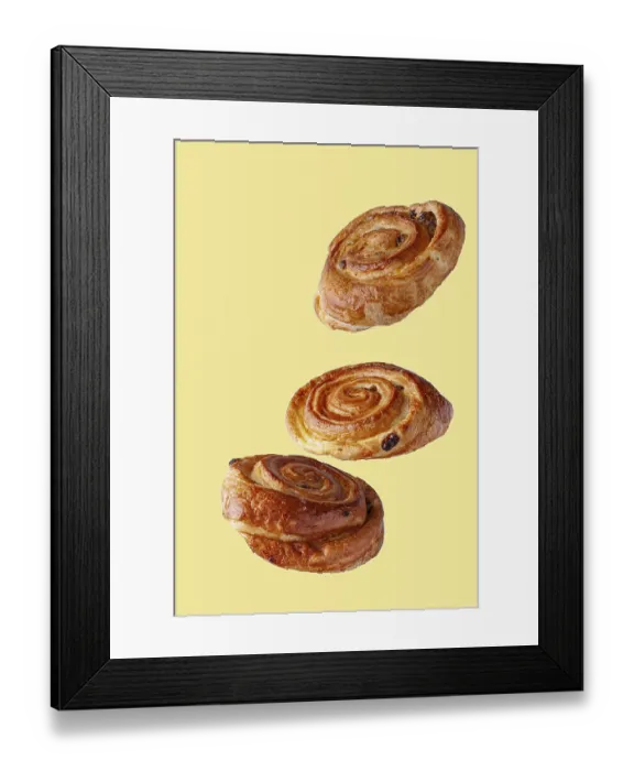 Framed Print : Buns with raisins flying food selective focus on yellow background