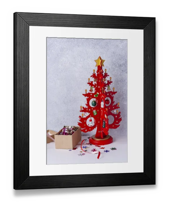 Framed Print : Wooden Christmas tree red and a box with toys