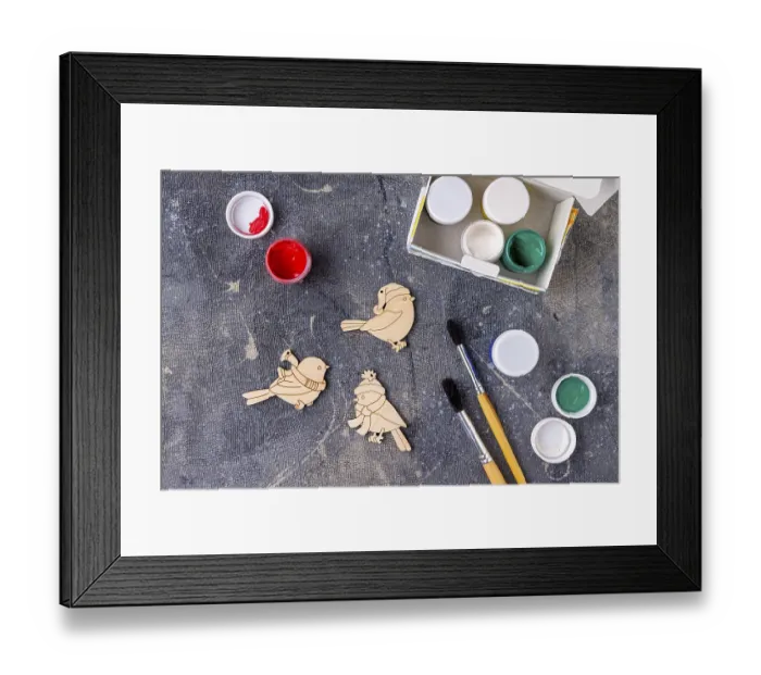 Framed Print : The process of painting wooden toys for the Christmas tree