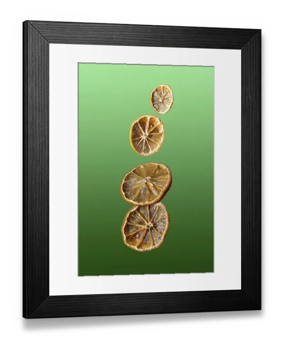 Framed Print : Dried fruit lemons fly on green gradient background