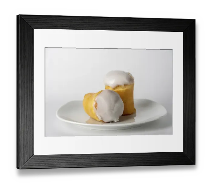 Framed Print : Two rum buns with icing on white plate, copy space