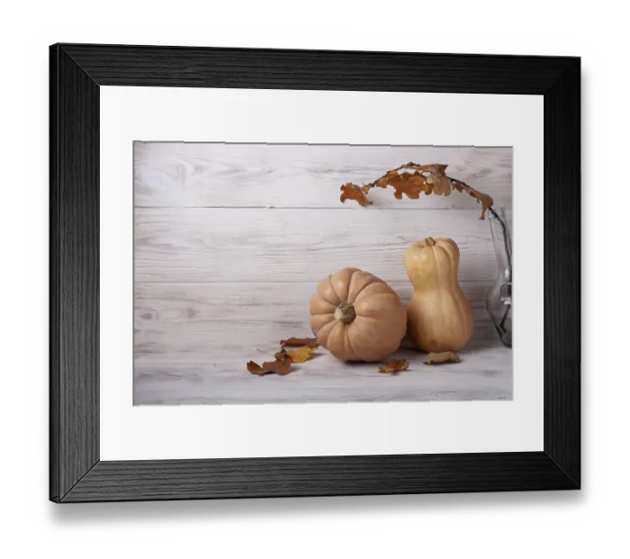 Framed Print : Pumpkins and autumn leaves on white wooden background