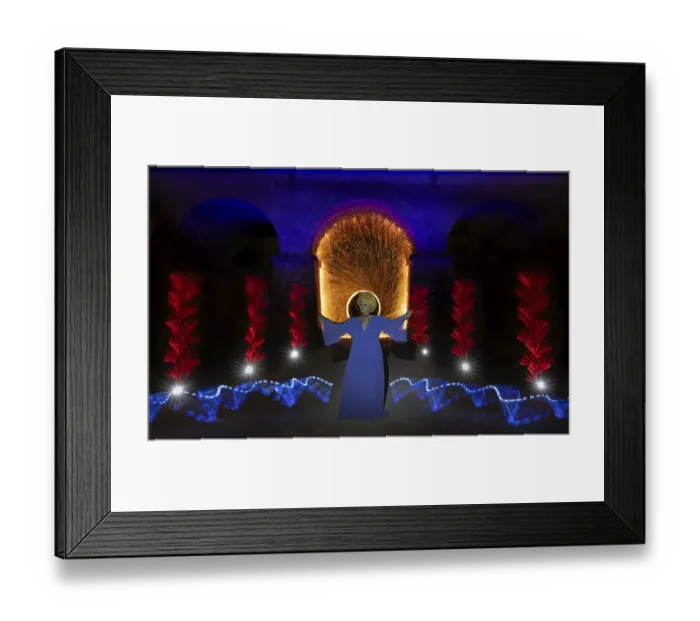 Framed Print : Fascinating light show with a woman in front of a symbolic backdrop under an arch