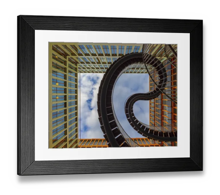 Framed Print : Modern spiral endless staircase between tall glass buildings