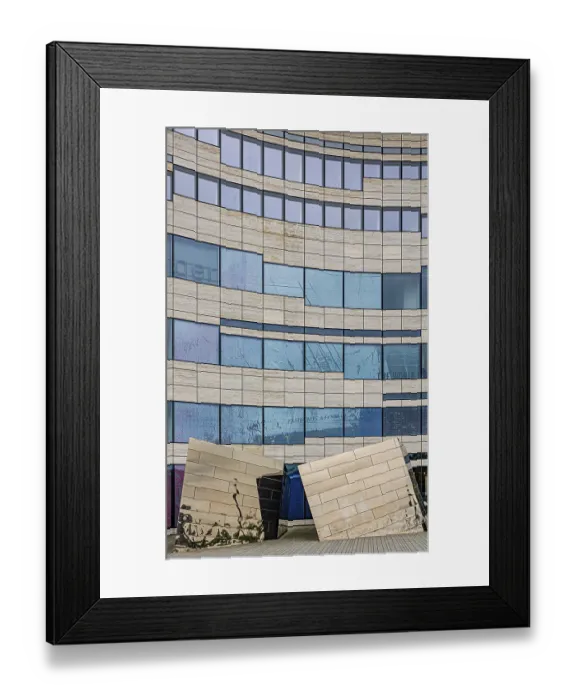 Framed Print : Building with undulating glass facade and artistic elements Framed Print : Building with undulating glass facade and artistic elements