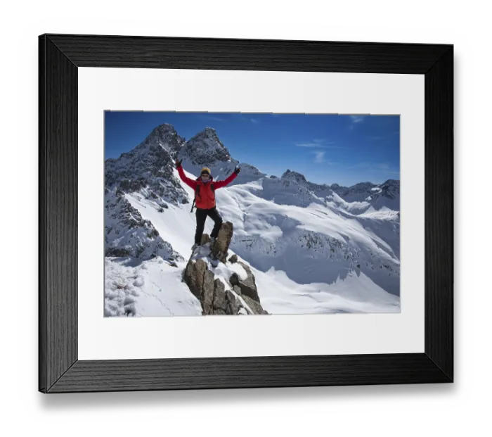 Framed Print : Ski tourer in victorious pose on the summit of the Landschaftsspitze
